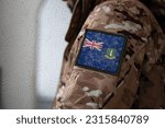 Small photo of British Virgin Islands Soldier, Soldier with flag British Virgin Islands, British Virgin Islands flag on a military uniform, British Virgin Islands army, Camouflage clothing