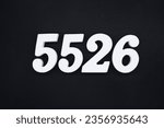 Small photo of Black for the background. The number 5526 is made of white painted wood.