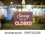 Sorry sign hang on mirror of shop