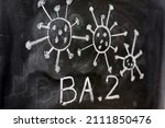 Small photo of Variant of covid 19 virus, omicron BA. 2, drawn on a blackboard with chalk