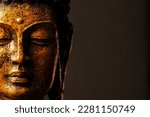 statue of buddha Bokeh background. Warm colors. Peace of mind concept