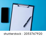 top view of blank paper on... | Shutterstock . vector #2053767920