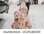 Little Girl Throws A Snowball...