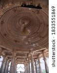 Small photo of Katariyasar, Bikaner, Rajasthan / India - October 02,2020: Red stone artistic large pillars in the sanctum sanctorum of the huge temple of Sant Jasnathji built in Katariyasar