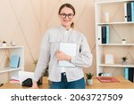 Small photo of Confident successful young caucasian headmaster teacher businesswoman tutor freelancer boss working in office, holding digital tablet. New idea, startup, deadline concept.