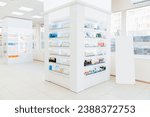 Small photo of Empty drugstore chemist`s shop pharmacy without staff clients customers visitors with remedies, pills, medicines, goods, painkillers, jars on shelves
