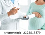 Small photo of Cropped image of pregnant woman visiting doctor. Gynecologist midwife prescribing medications pills treatment to expectant mother. Gestation, lactation, fetus health