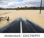 Flooded rural road during...