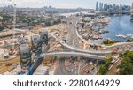 Small photo of Aerial drone view of Rozelle Interchange showing major construction works and the large chimney towers with Anzac Bridge and Sydney City in the background in March 2023