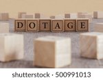 Small photo of DOTAGE word written on building blocks concept