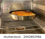 Typical Austrian dessert pastry ('Kaiserschmarren') baking in a pan in the oven