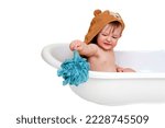 Small photo of Unhappy baby toddler boy is sitting in a bathtub, isolated on white background. Squeamish child at the age of one year