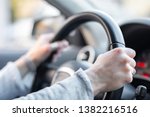 Women hands holding car steering wheel - Female hand close up shallow dof depth of field driving car - Hands on steering wheel in traffic