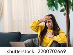 Small photo of Nauseous attractive young woman, having chest pain and feeling her body temperature.
