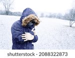 Small photo of One man sensitive to cold freezing outdoor in the snow