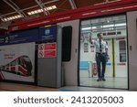 Small photo of JAKARTA, INDONESIA-JANUARY 2024- Train officers inspect carriages in the Jabodebek LRT train series at Dukuh Atas LRT station on 16, January 2024 in Jakarta.