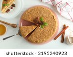 Concept of tasty dessert with honey cake, top view