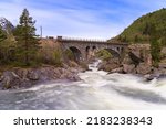 The Stuguflåt Bridge (Norwegian: Stuguflåtbrua or Stuguflåten bru), a stone railway bridge north of Stuguflåten on the Rauma Line over the Rauma River in Innlandet county, Norway. 