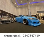 Small photo of Galaxy Mall, Surabaya. August 12, 2022. The blue Honda Civic FD is next to the FT86 with a racing concept.