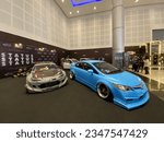 Small photo of Galaxy Mall, Surabaya. August 12, 2022. The blue Honda Civic FD is next to the FT86 with a racing concept.