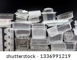 Many clean plastic boxes for food packaging. Pile of disposable plastic containers for take away food.