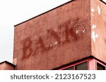 Aged and worn vintage photo of bank sign