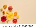 Autumn , summer background with flowers and gift box. Flat lay , copy space