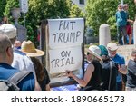 Small photo of Boston, Massachusetts, US-June 15, 2019: Protesters hold signs reading "Impeach Trump"