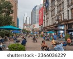 Small photo of New York, NY, US-September 8, 2023: Tourists and NY residents in Herald Square, a public park in mid-town Manhattan on a warm day.