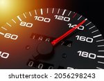Car speedometer. Auto car speedometer shows 140 km h or miles.Closeup shot,dark black background.Automobile dangerous speed concept