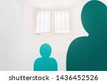 Small photo of Blue simplified figure. Two men in the jail, looking out the small window with bars. Prisoner within four walls. Imprisonment concept. Copy space