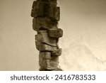 Small photo of Fragment of a wall made of logs, close-up. Log house corner. Fragment of a wall made of logs. Wall of an eco-friendly wooden house. Tow between the logs on the wall of the old house.