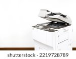 Small photo of Photocopier printer, The copier or photocopy machine office equipment workplace on white wall background for scanner or scanning document and printing or copy paper duplicate and Xerox.