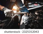 Car care maintenance and servicing, Hand technician auto mechanic using the wrench to fix car or repairing change spare part engine problem and insurance service support the range of car check.
