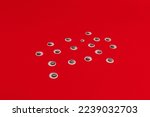 Plastic eyes for decor on a red background