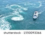 The world largest whirlpools in Naruto Channel and a sightseeing boat.