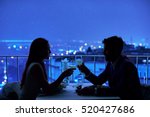 Young couple at restaurant having dinner. Silhouette 
