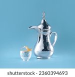 Small photo of traditional coffee up , arabic coffee cup , finjan, dallah is a metal pot with a long spout designed specifically for making Arabic coffee, Saudi coffee wood background.