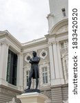 Small photo of The Stamford Raffles statue in front of the Victoria Memorial Hall and Theatre, sculpted by Thomas Woolner, is a popular icon of Singapore. The statue survived World War II unscathed
