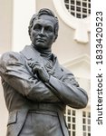 Small photo of The Stamford Raffles statue in front of the Victoria Memorial Hall and Theatre, sculpted by Thomas Woolner, is a popular icon of Singapore. The statue survived World War II unscathed
