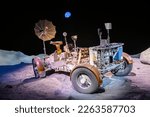 Small photo of Houston USA 4th Feb 2023: Lunar Roving Vehicle (LRV) in Space Center Houston. a battery-powered four-wheeled rover used on the Moon in the last three missions of the American Apollo program.