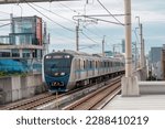 Small photo of Pulo, South Jakarta, Indonesia - April 1, 2023: Public Transportation Mass Rapid Transit bound for Lebak Bulus is entering MRT Block A Station in Jakarta at noon.