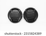 Small photo of Two black camera lens caps with a diameter of 52mm, designed to provide good protection for the camera front glass from dust, scratches and accidental damage.