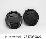 Small photo of Two black camera lens caps with a diameter of 52mm, designed to provide good protection for the camera front glass from dust, scratches and accidental damage.