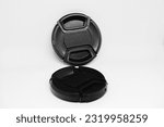 Small photo of Two black camera lens caps with a diameter of 52mm, designed to provide good protection for the camera front glass from dust, scratches and accidental damage.