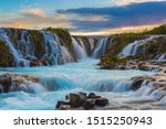 Majestic summer sunrise on Bruarfoss Waterfall.
The 'Iceland’s Bluest Waterfall.' Blue water flows over stones. Midnight sun of Iceland. Visit Iceland. Beauty world.