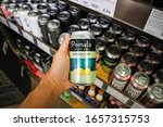 Small photo of West Covina, California/United States - 02/19/2020: A hand holds a can of Pomelo Wino Company Sauvignon Blanc canned wine on display at a local grocery store.