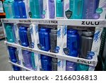 Small photo of Los Angeles, California, United States - 05-20-2022: A view of several containers of Zulu half gallon reusable plastic water bottles, on display at a local big box grocery store.