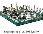 Small photo of Malachite stone green chess pieces with nacreous elements as rivals, in centre on marble chessboard. Close up game concept competition, Classic Tournament.