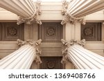 Court house or museum pillars or columns looking straight up and symmetrical 